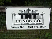TNT Fence Company sponsor sign